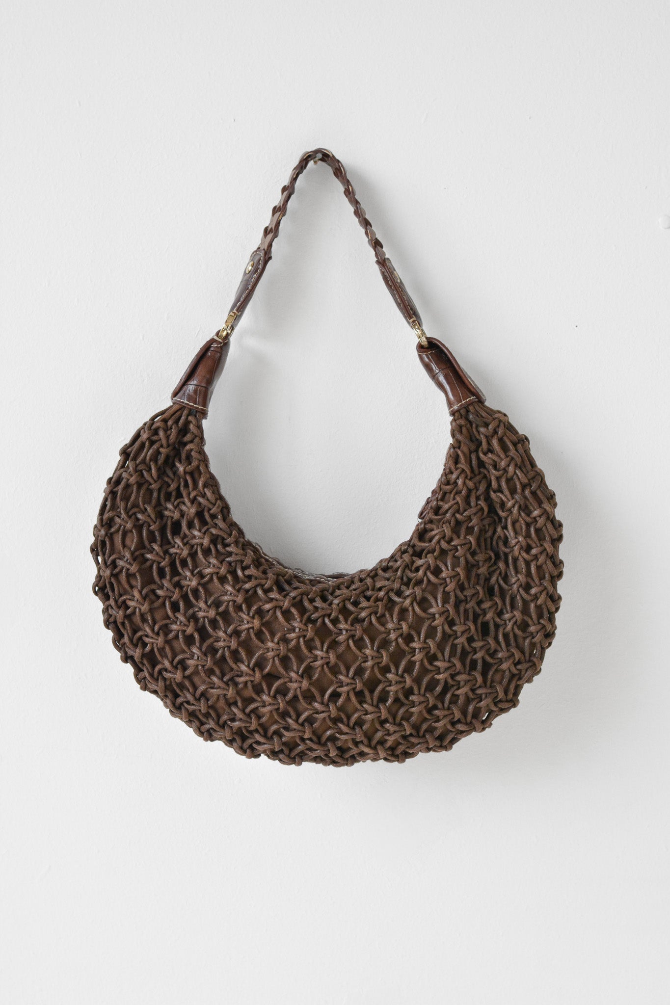 Vintage brown faux leather woven purse with braided strap.