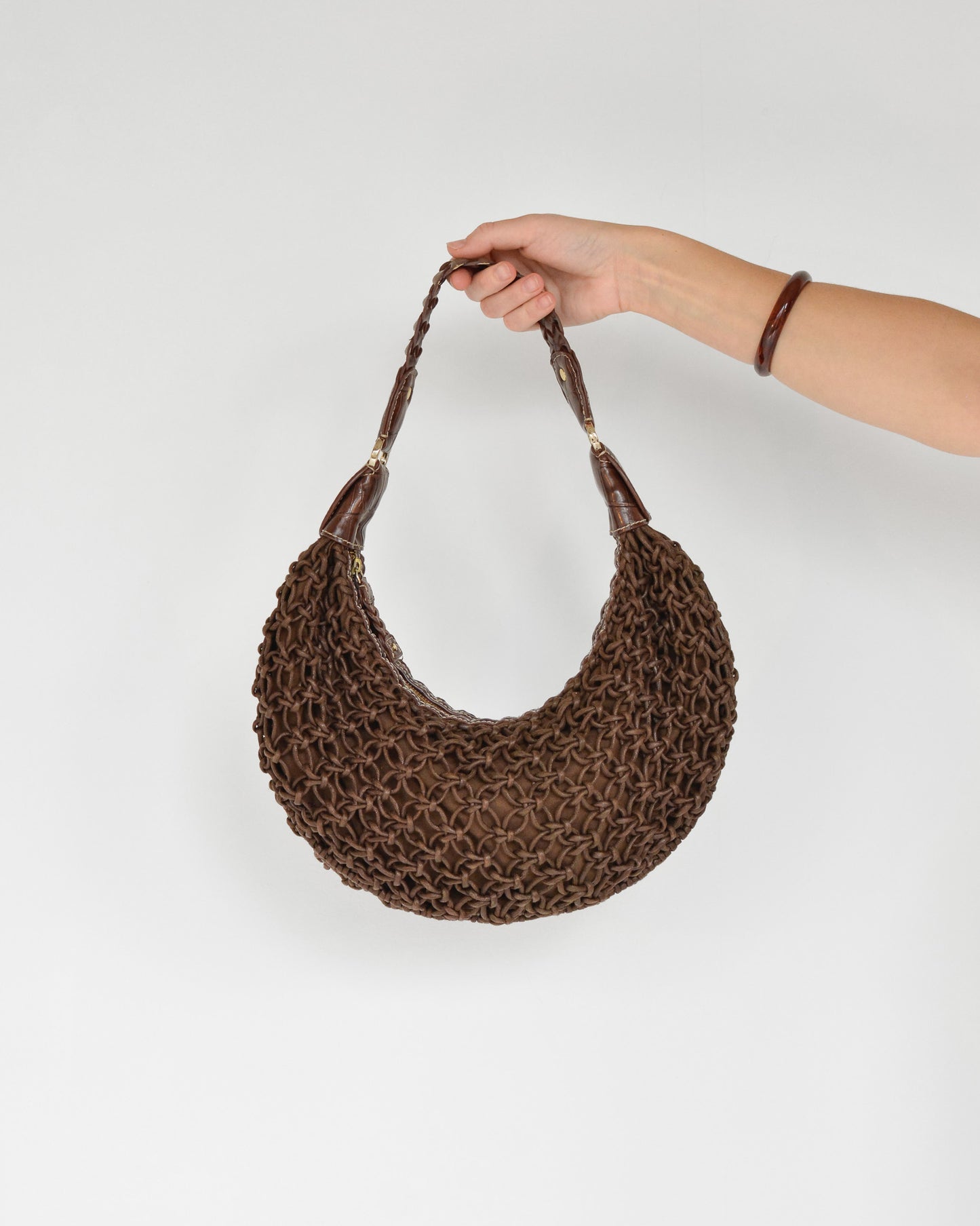 Vintage brown faux leather woven purse.