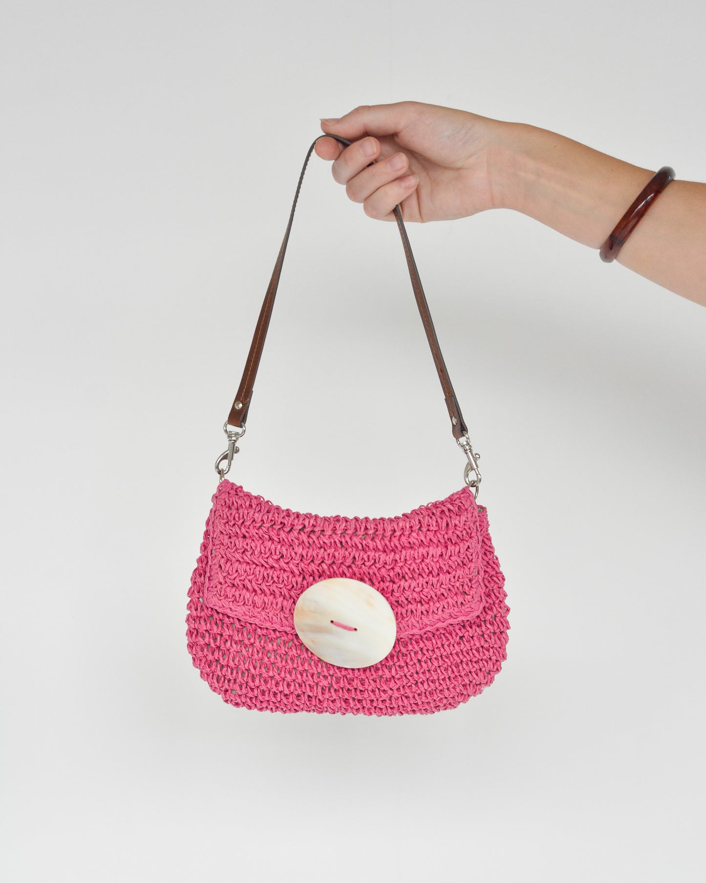 Vintage pink woven mini shell purse with faux leather brown strap.